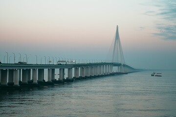 Obraz premium Scenic view of Hangzhou Bay Bridge during sunrise in the eastern coastal region of China