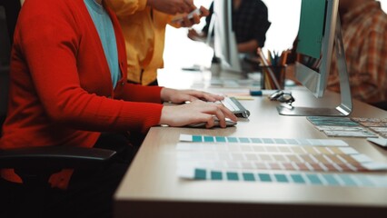 A vibrant design session in a modern workspace highlights creative professionals collaborating over...