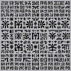 Fototapeta premium Mysterious Symbols: A close-up view showcases a collection of intriguing glyphs, their meaning obscured by the veil of ancient and modern languages.