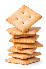 Stacked pile of crispy saltine crackers, isolated on white background