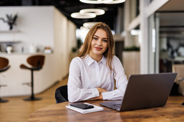 Portrait of young businesswoman working in office