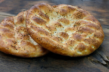 Pide - Turkis pita on rustic wood background