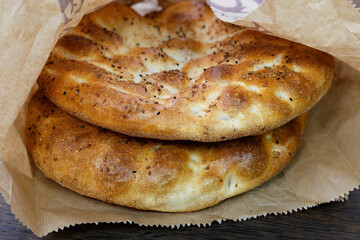 Pide - Turkis pita on rustic wood background