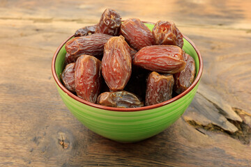 dried dates on a rustic wooden table