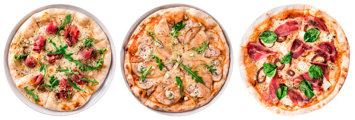 various pizzas isolated on a plate with Parma ham, pear and gorgonzola, basil