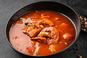 Tomato meat soup vegetable goulash fresh tasty food dish delicious gourmet food background on the table rustic food top view copy space keto and paleo diet