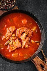 Tomato meat soup vegetable goulash fresh tasty food dish delicious gourmet food background on the table rustic food top view copy space keto and paleo diet