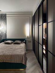 This cozy bedroom features a plush bed adorned with soft pillows, complemented by a sleek, modern closet illuminated from within, enhancing the room's ambiance and elegance.