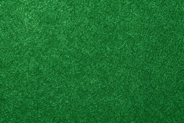close-up photo of vibrant green artificial turf with finely textured blades of grass