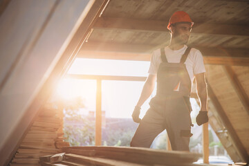 Process of construction new and modern modular house. Worker man in special protective uniform wear...