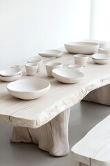 A rustic wooden table showcases handcrafted ceramic bowls, creating a simple yet beautiful dining space