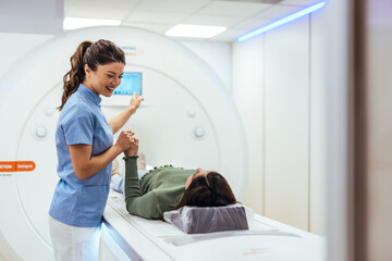 Healthcare Professional Assisting Patient During MRI Scan in Modern Medical Facility
