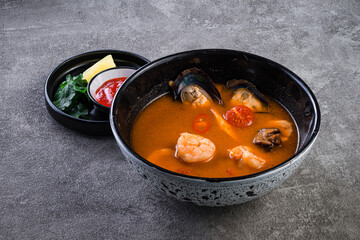 Thai dish tom yam. Traditional spicy soup close-up