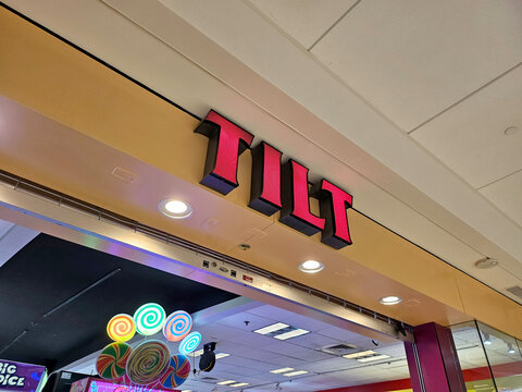 Enjoying a fun-filled day at the TILT arcade in Oahu, Hawaii with games and laughter
