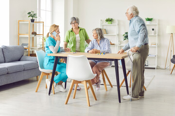 Obraz premium Senior old group and caring kind nurse together making phone call, geriatric medicine caretaker helping for nursing home residents, senior adults in assisted living, female doctor visiting patients 