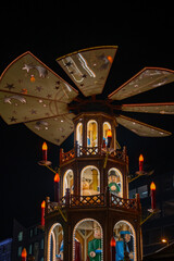 Night photo of a traditional Christmas Pyramid at a Munich, Germany Christmas market