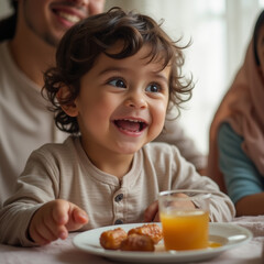Happy Child Enjoying Iftar with Family During Ramadan &ndash; Smiling Toddler with Dates and Juice