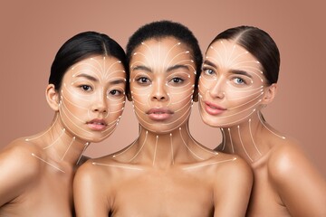 Three multiethnic women are practicing facial massage techniques aimed at skin rejuvenation, focusing on anti-aging methods. They showcase a serene environment suited for pampering and self-care.