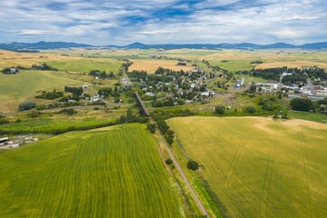 Aerial view of Tekoa, Washington, USA, showcasing the town's layout, the surrounding wheat fields,...