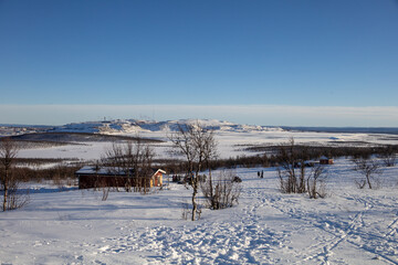 Stunning sunset view over Kiruna city and mine with snow covered trees in Swedish Lapland
