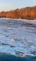 Frozen lake with trees in the background