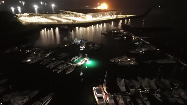 Cinematic aerial view from a drone at night on the Amador Causeway in Panama City, 4K Video