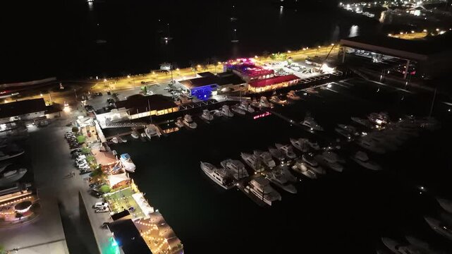 Cinematic aerial view from a drone at night on the Amador Causeway in Panama City, 4K Video