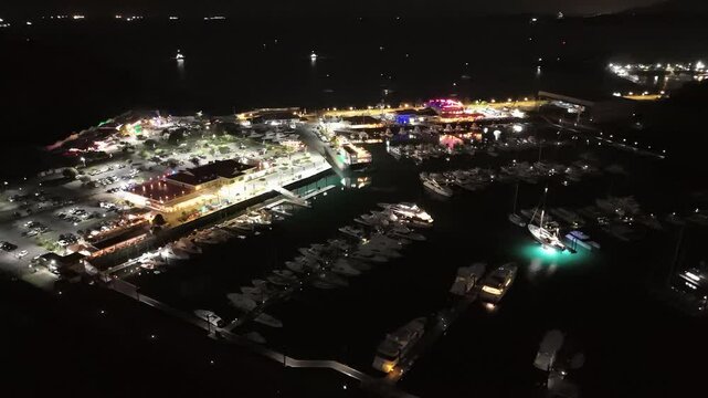Cinematic aerial view from a drone at night on the Amador Causeway in Panama City, 4K Video