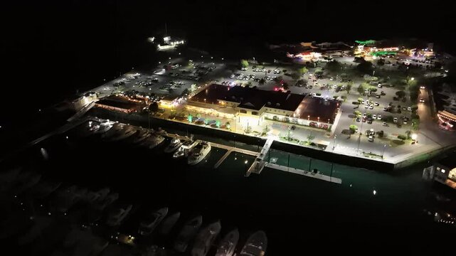 Cinematic aerial view from a drone at night on the Amador Causeway in Panama City, 4K Video