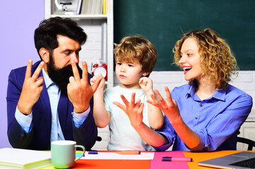 Schoolboy with teachers study mathematics and counting on fingers. Mathematics for children in...