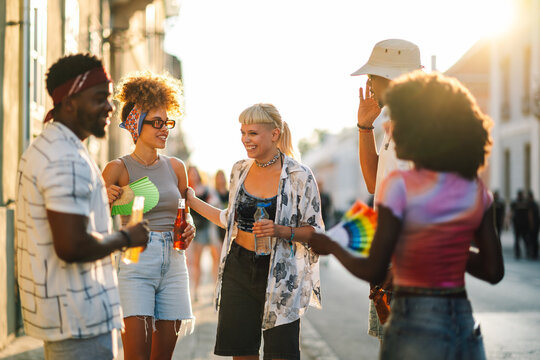Young tourists enjoying sightseeing and refreshing drinks on a sunny summer day