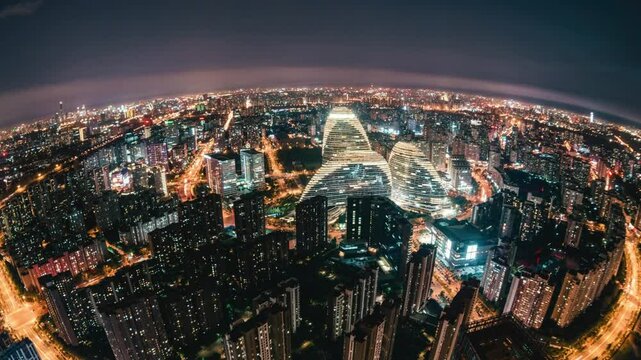 Vue a&eacute;rienne nocturne d&rsquo;une m&eacute;tropole illumin&eacute;e avec buildings modernes et rues anim&eacute;es