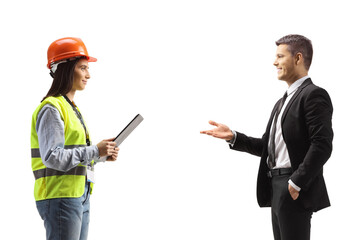 Businessman talking to a female engineer