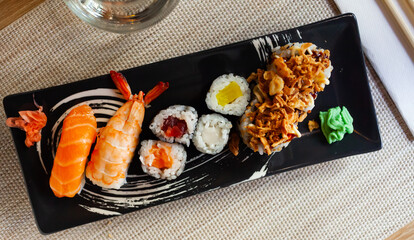 Various of sushi traditionally served with pickled ginger, wasabi and soy sauce. Japanese cuisine