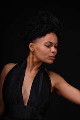 Fototapeta premium Close up portrait of curly young woman on black background