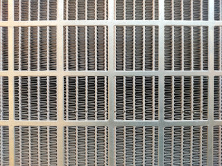 Stainless Steel Mesh Showcasing Intricate Patterns Under Soft Natural Light in an Industrial Setting