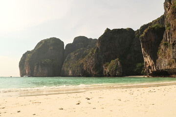 At Maya Bay, scenic view onto the white beach, the turquoise sea and high Karst rocks, Ko Phi Phi...
