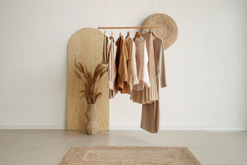 Clothes rack and vase with pampas grass in boutique