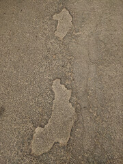 Damaged asphalt road surface showing signs of wear and tear in kokorin, czechia