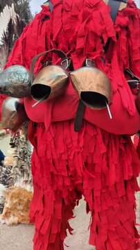 Kukeri costumes and masks with bells in the clothing, dedicated to the annual Kukeri folklore festival in Bulgaria