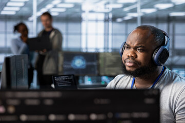 Admin in server hub listening music and ensuring compliance with industry standards and regulatory...