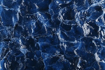 Obraz premium Abstract blue water texture, close-up view of swirling and rippling surface.