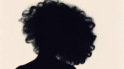 Stunning vector silhouette of a curly African woman, perfect for beauty salon or hair product logos