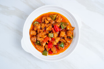 fried crispy chicken with sweet and sour sauce in Korean style. Perfect for recipe, article, catalogue, or any commercial purposes. With copy space