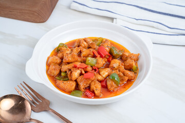 fried crispy chicken with sweet and sour sauce in Korean style. Perfect for recipe, article, catalogue, or any commercial purposes. With copy space