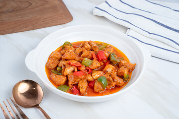 fried crispy chicken with sweet and sour sauce in Korean style. Perfect for recipe, article, catalogue, or any commercial purposes. With copy space