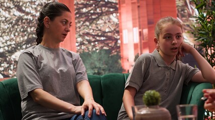 Family therapy session explores the emotional and mental health of a teenager, with the psychologist helping her and her mother address intrusive thoughts and behavioral problems. Camera A.