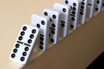 row of dominoes on an edge