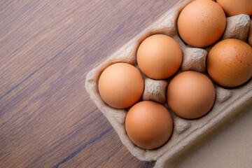 Chicken Eggs in paper cages.