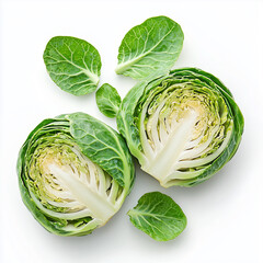 Fototapeta premium Two halves of green brussels sprouts surrounded by leaves, isolated on white background.